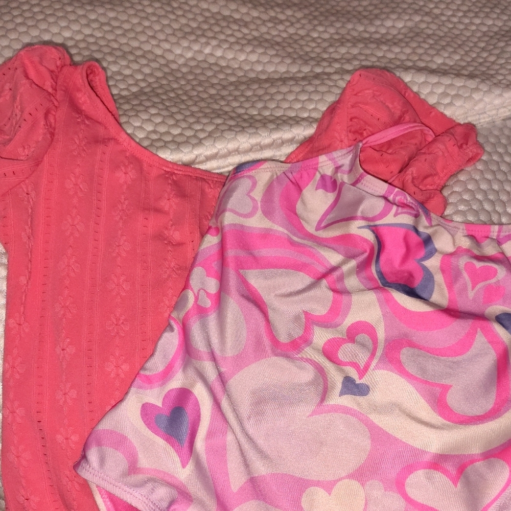 Pink and Patterned Baby Onesies